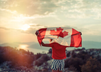 girl-carrying-canadian-flag